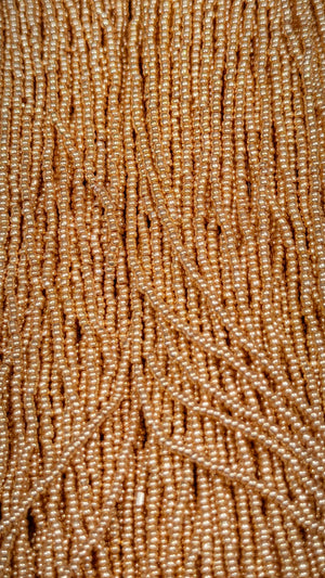 Close-up of champagne gold vintage seed beads