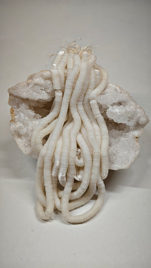 Hank of 5mm pearl white cuvettes, Norman Hartnell archive