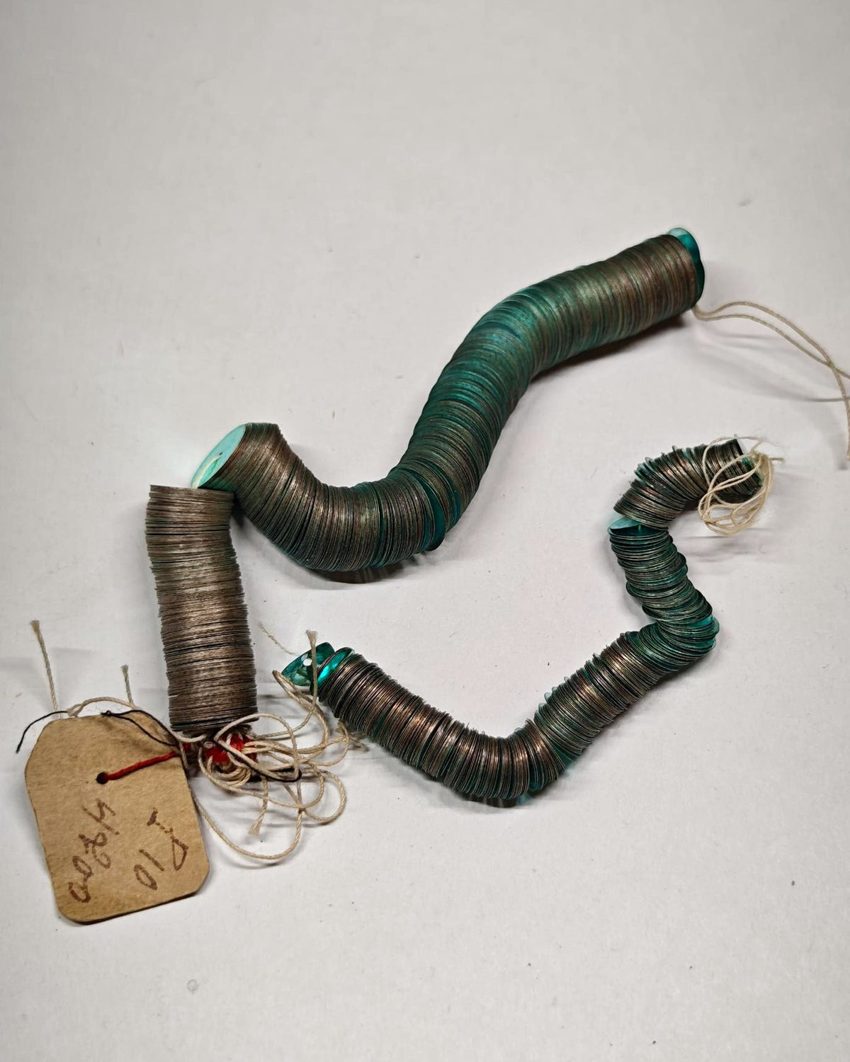 Turquoise real metal sequins roll with handwritten tag