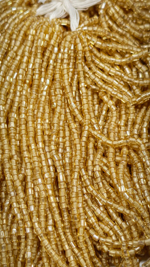 Close-up of pale gold silver-lined vintage glass tubes