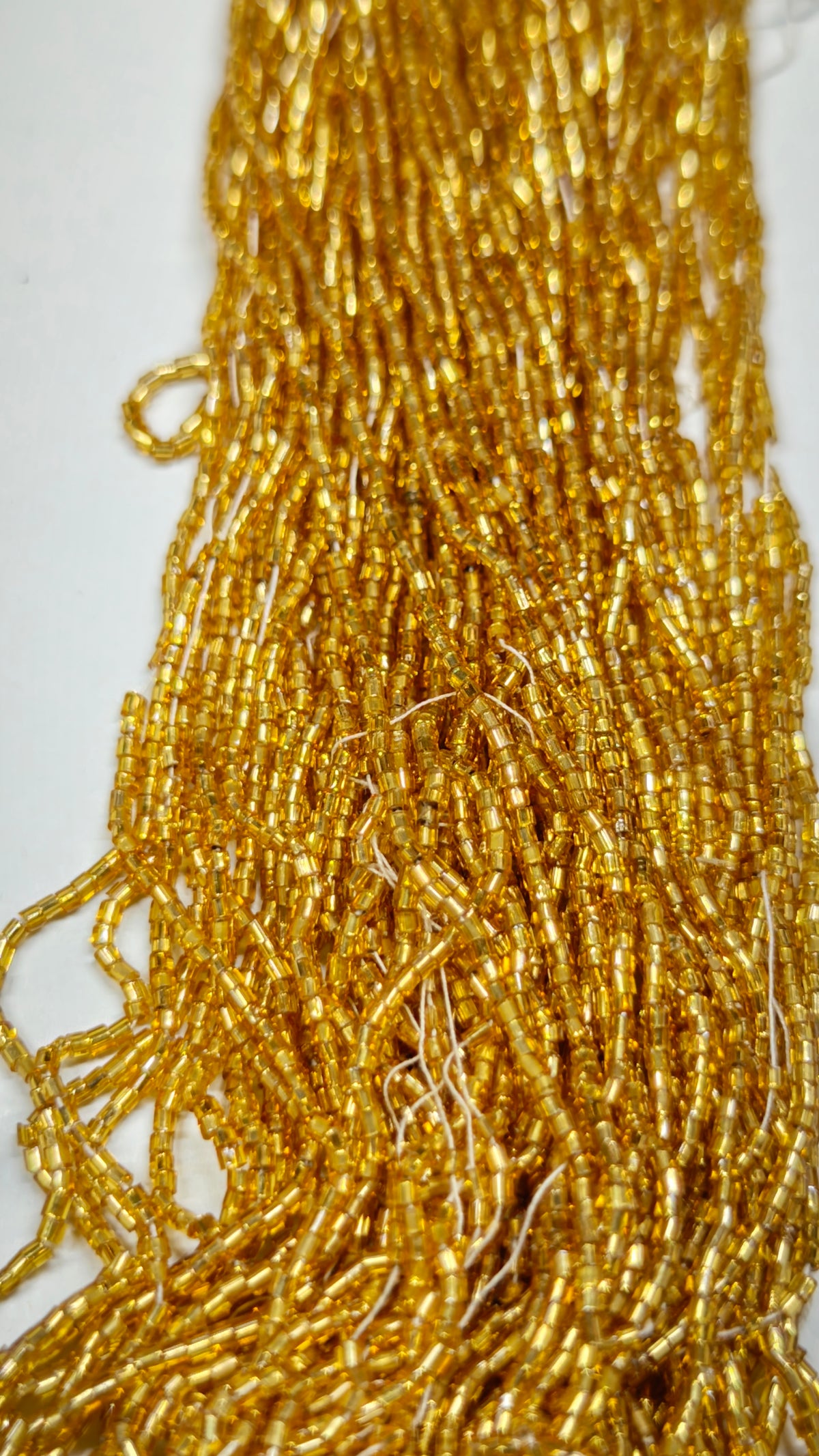 Close-up of tiny gold silver-lined tubes