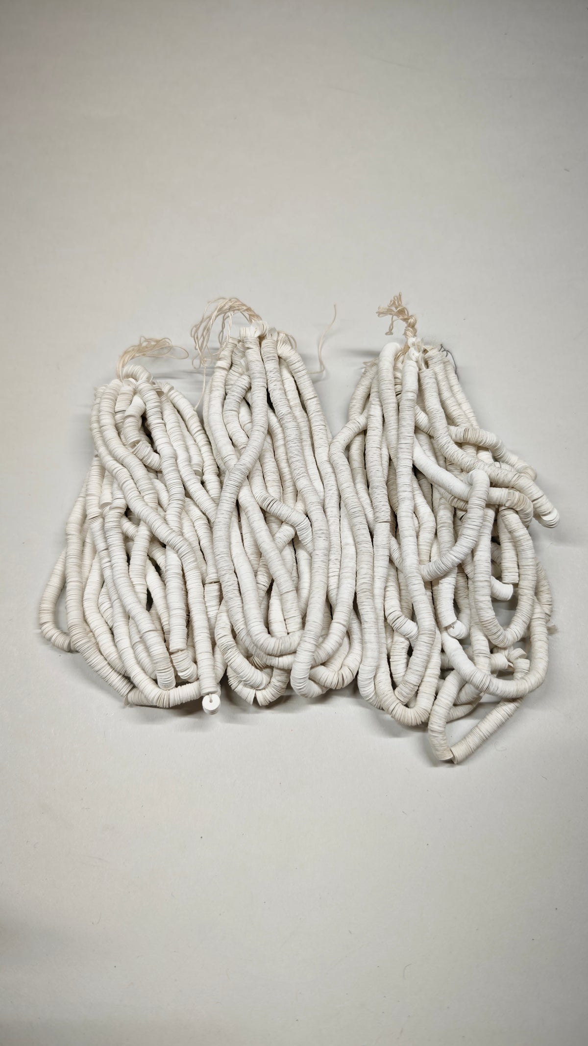 Three hanks of 5mm matte white cuvettes and sequins, Norman Hartnell archive
