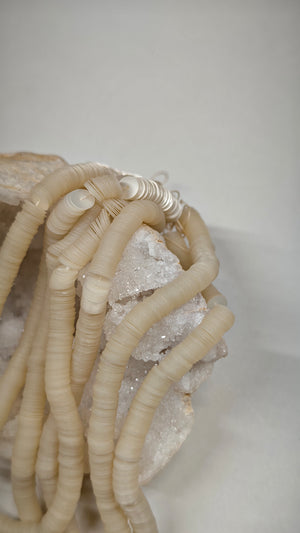 Close-up of 6mm cream perlaine sequins