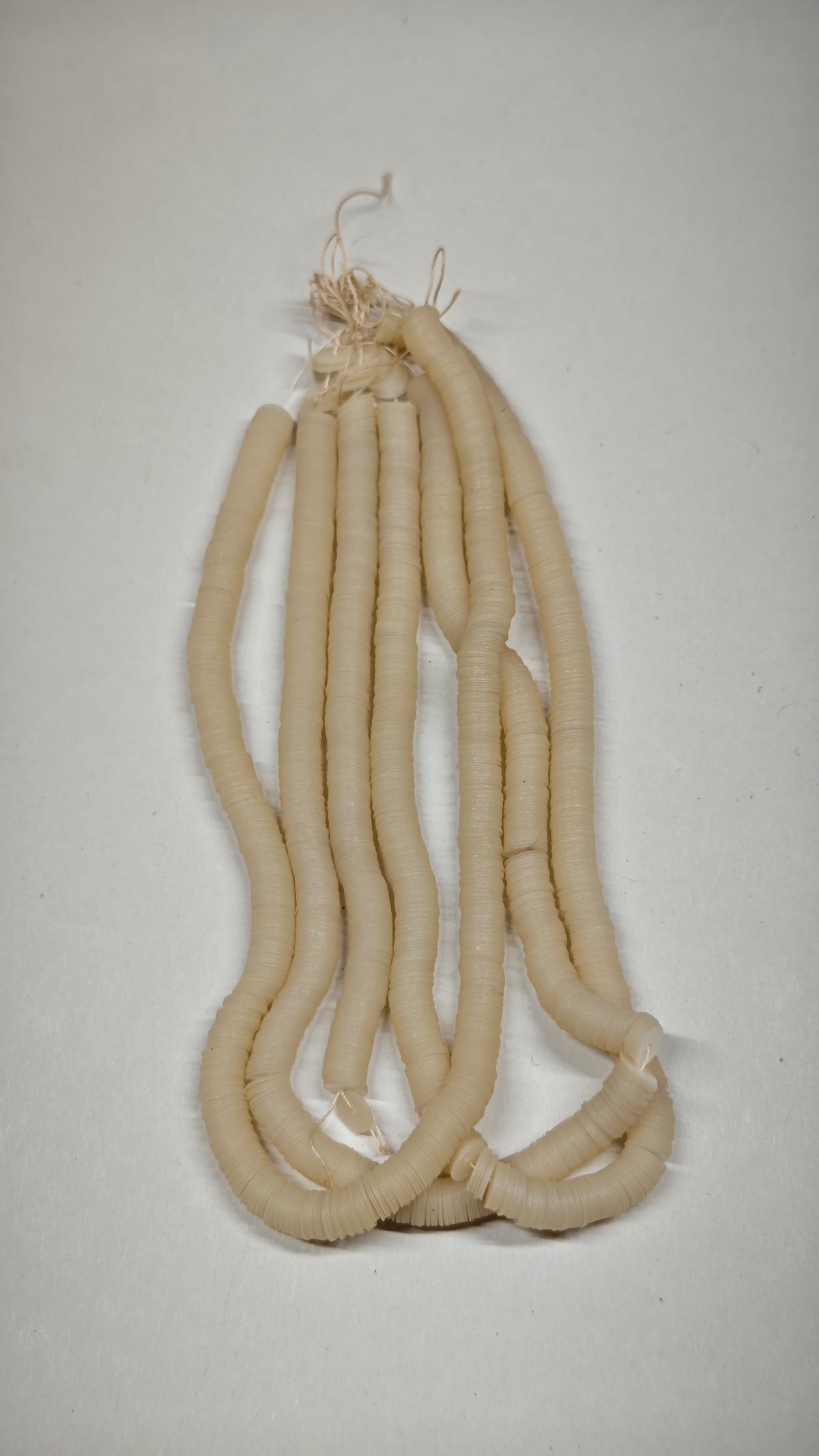 Three threads of 6mm cream perlaine sequins