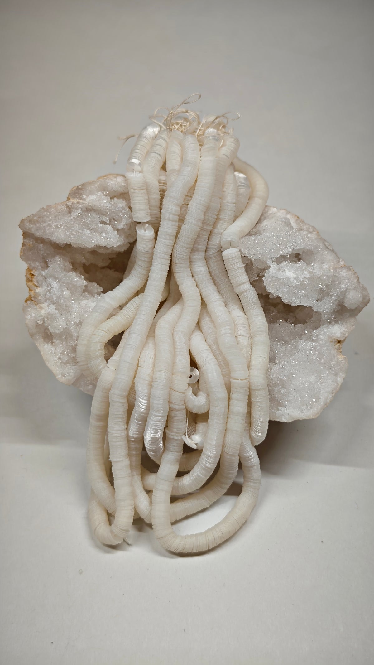 Hank of 5mm pearl white cuvettes, Norman Hartnell archive