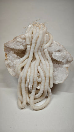 Hank of 5mm pearl white cuvettes, Norman Hartnell archive