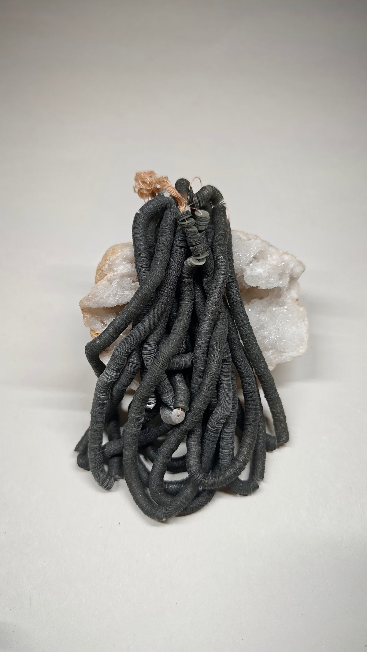 Hank of 6mm grey satin sequins, Norman Hartnell archive
